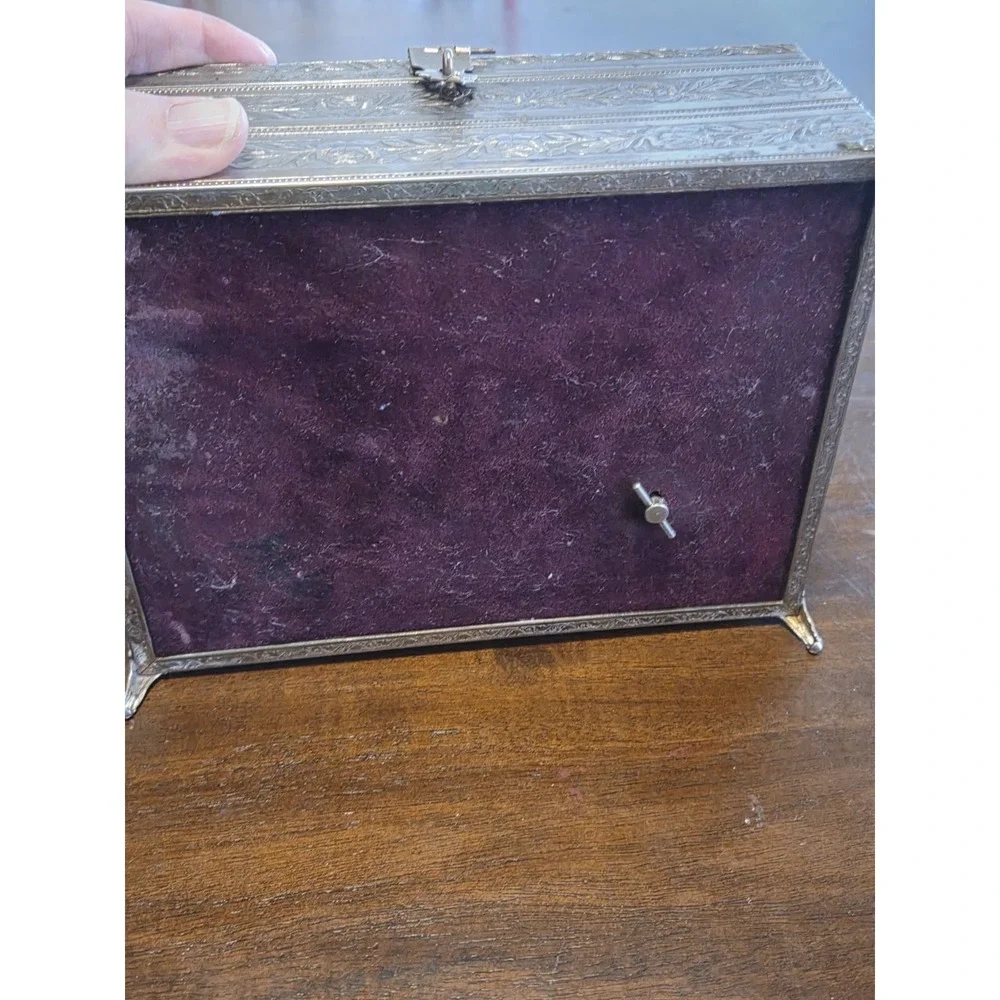 antique etched brass trinket box features a hinged lid Music Box